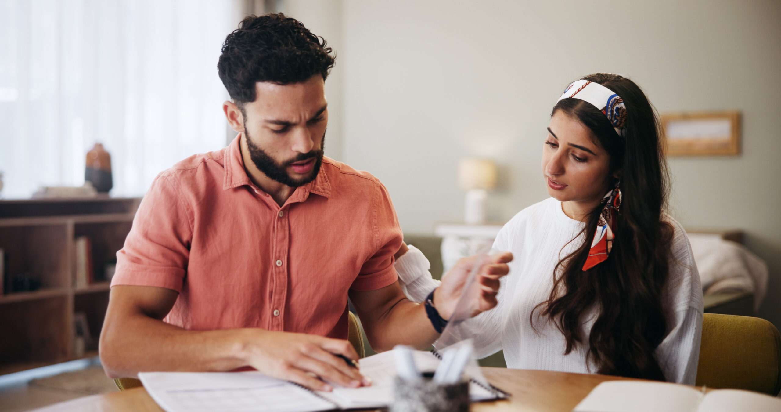Finance, documents and couple in home unsure for budget review, savings and payment mistake for mortgage. Marriage, confused and man with woman with paperwork, bills and financial expenses for taxes.
